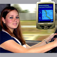 Woman driving a car and using a satellite navigator
